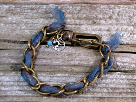 Bracelet - Cerulean Charm, Cerulean golden light ribbon woven into an antique brass chain with Swarovski crystal charm.