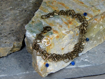 Bracelet - Vision, square droplet brass chain draped with blue Czech glass.