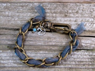 Bracelet - Cerulean Charm, Cerulean golden light ribbon woven into an antique brass chain with Swarovski crystal charm.