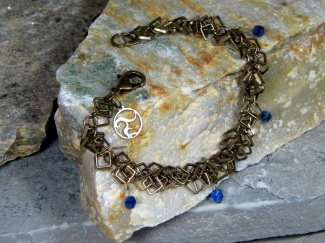 Bracelet - Vision, square droplet brass chain draped with blue Czech glass.